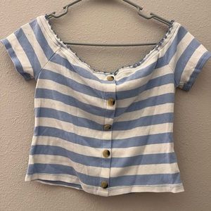White top with light blue stripes and buttons
